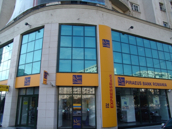 Piraeus Bank va vinde subsidiara din România către J.C. Flowers & Co.